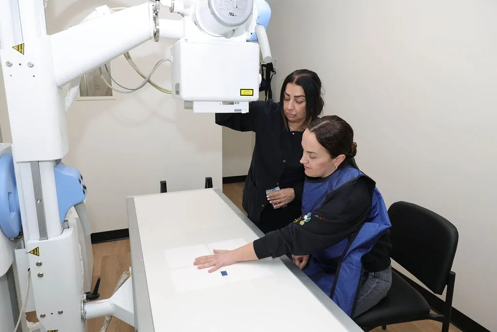 A hand being X-rayed on site at Serenity Urgent Care after an injury