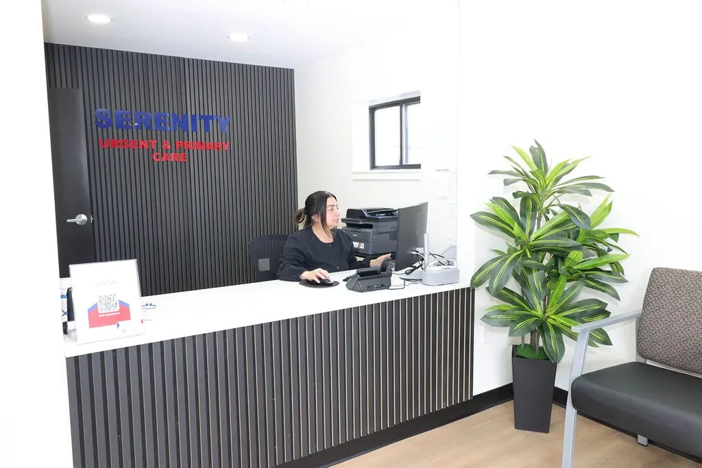 The reception desk and waiting area inside Serenity Urgent Care